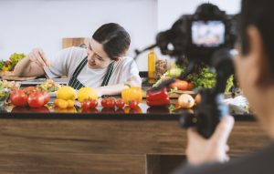 young woman recording her cooking